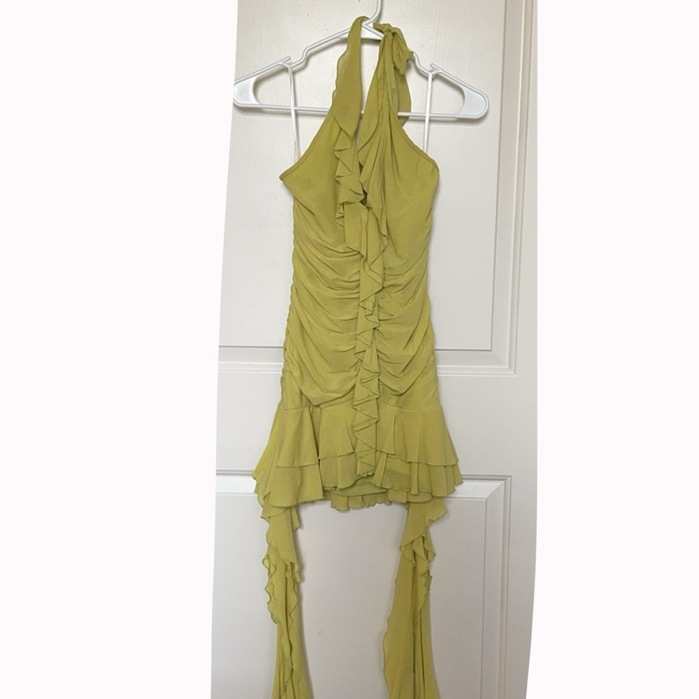 Super cute neon, green ruffle halter dress with long side pieces. Worn once